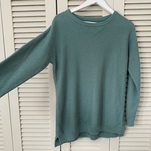 Knit sweater.